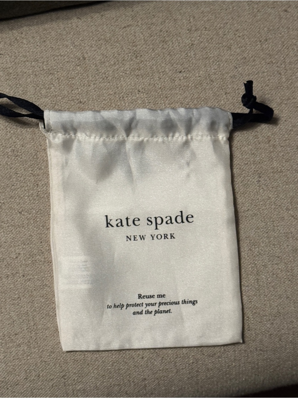 kate spade White Satin Drawstring Jewelry Pouch with Black Cord